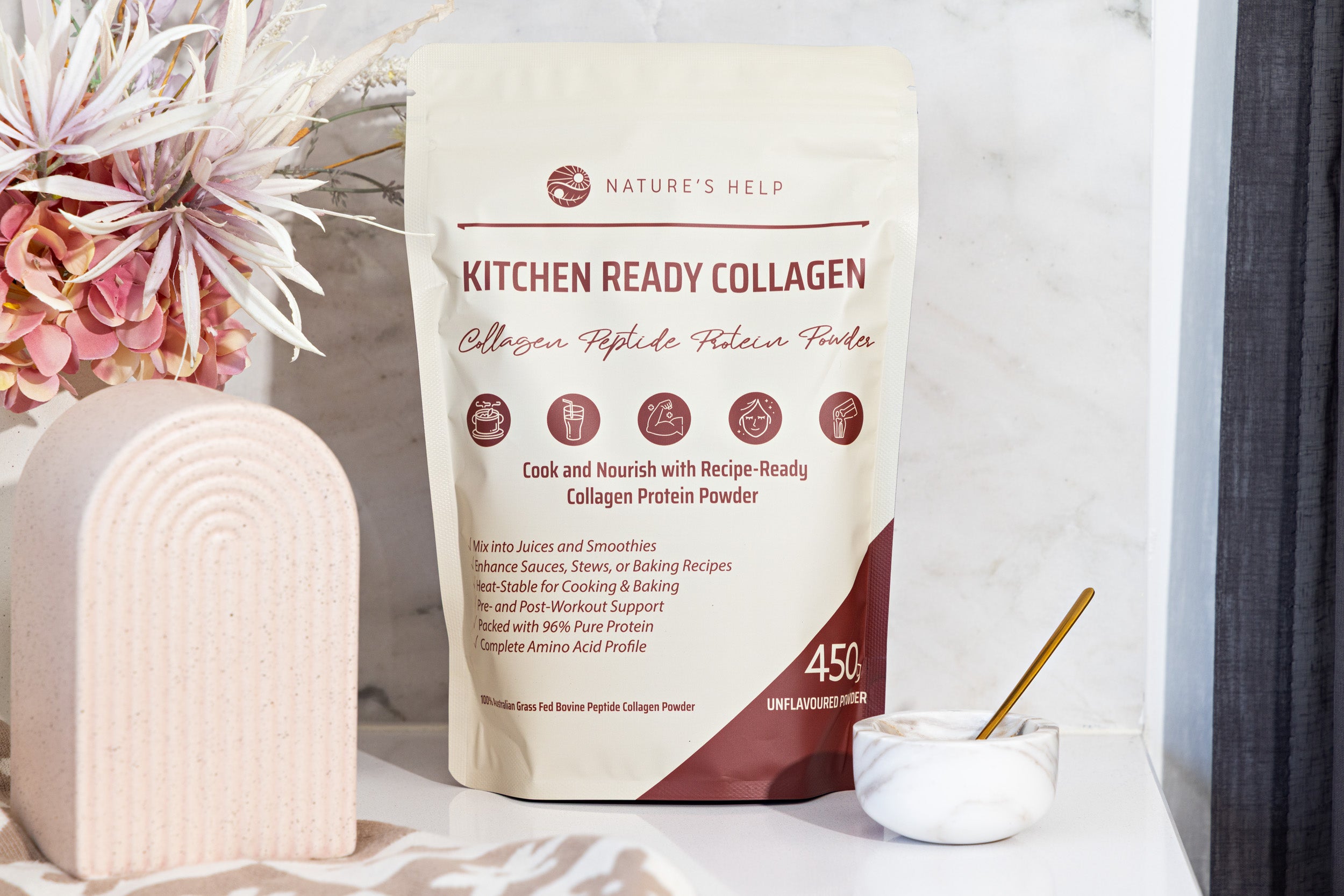 Nature's Help Kitchen Ready Collagen package on a white surface with flowers and a bowl.